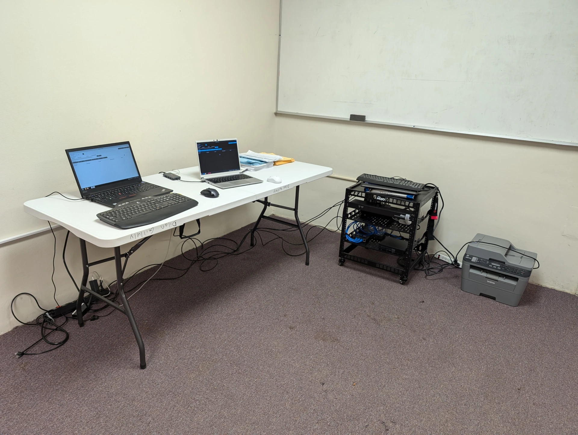 Rack setup with two of the laptops connected.